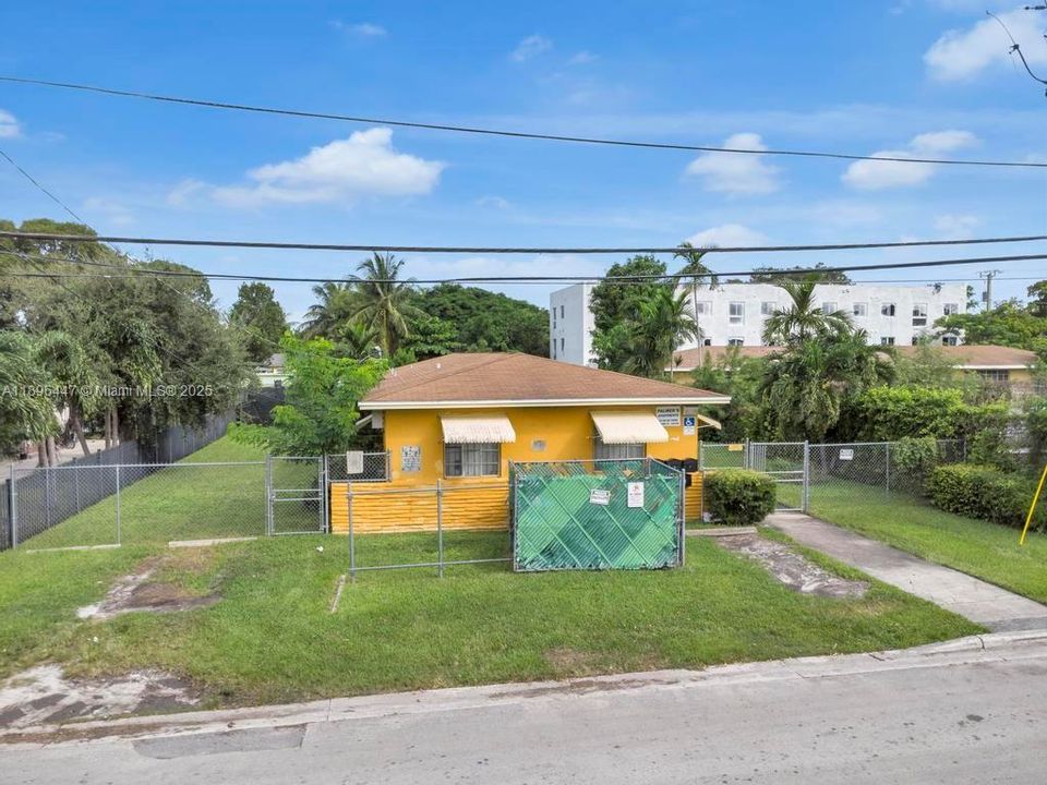 Front view of the multifamily fourplex in Miami’s Little River area, featuring well-maintained landscaping and strong curb appeal — ideal for investors seeking a prime rental location.