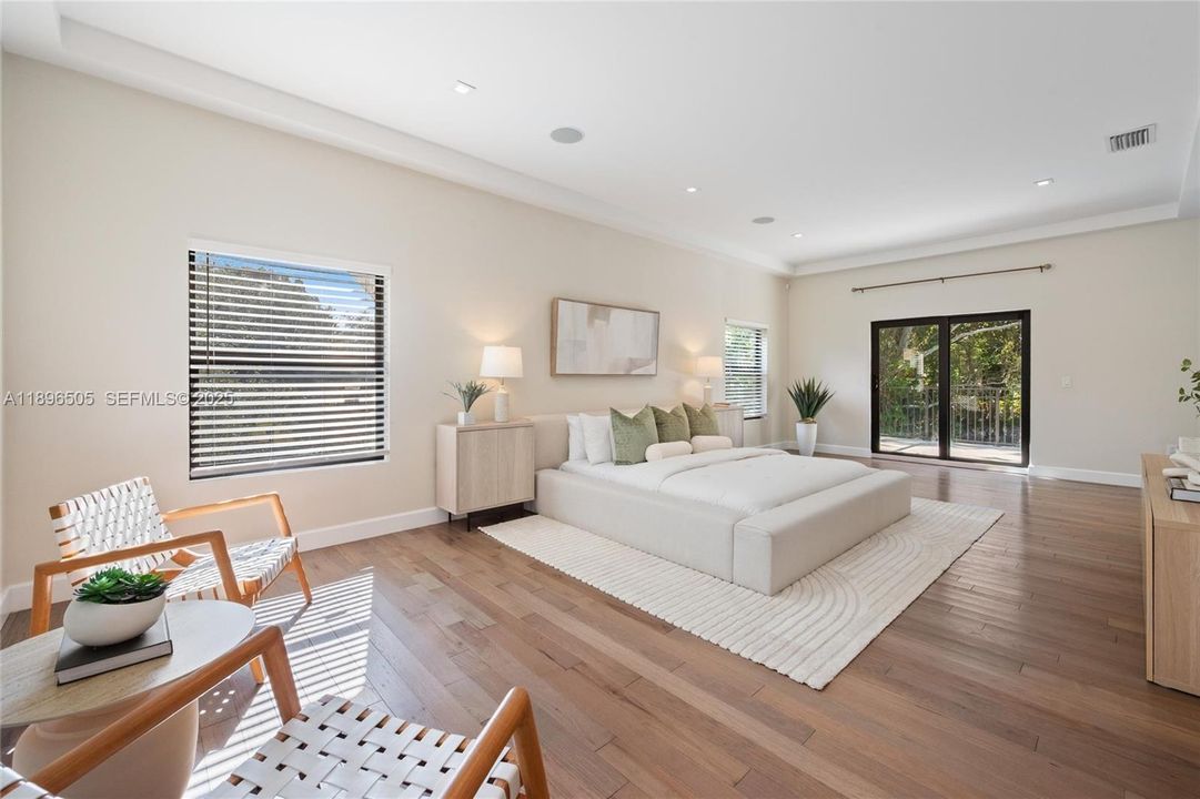 Large Primary Suite with oversized deck, spa bathroom, and dual walk-in closets.