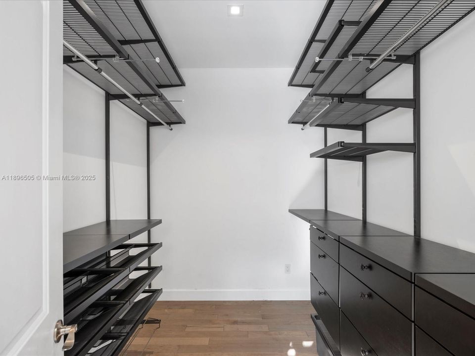 Dual walk-in closets in the primary bedroom.