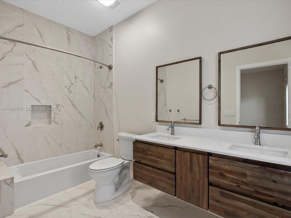 Bedroom 2 includes a private en suite bathroom for added comfort and convenience.