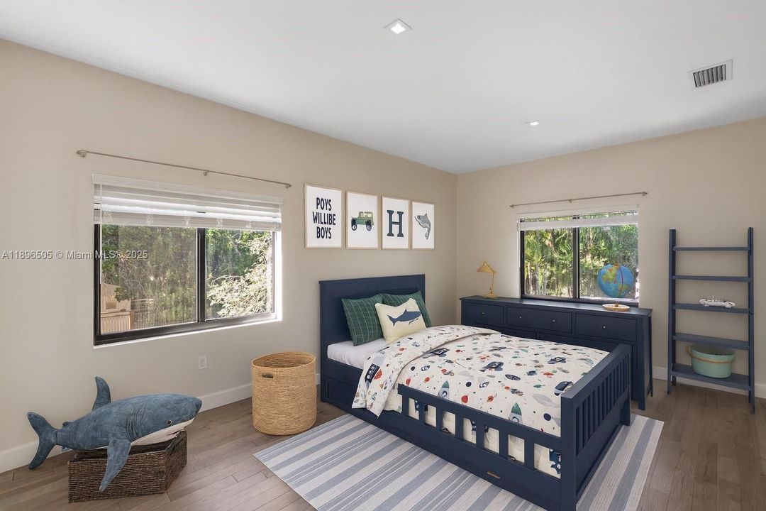 2nd Bedroom. Spacious second-floor bedroom featuring an en suite bathroom and a walk-in closet.