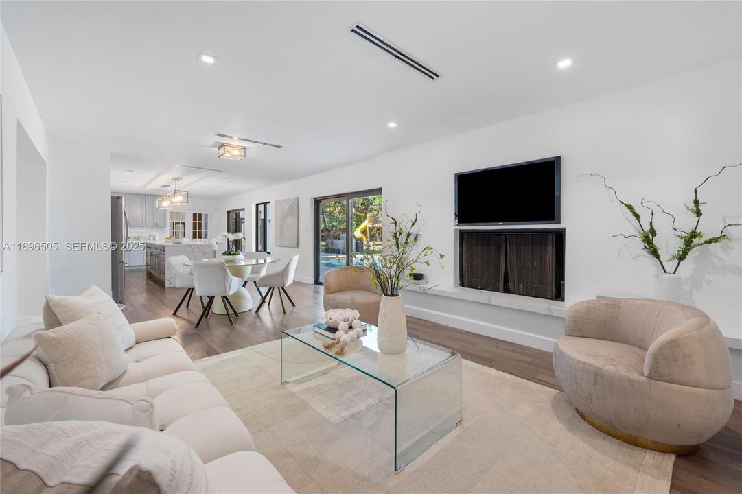 Beautiful sitting area with fireplace off of the kitchen.