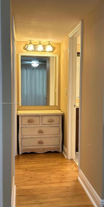 A hall to the master bedroom bathroom and the walk-in closet