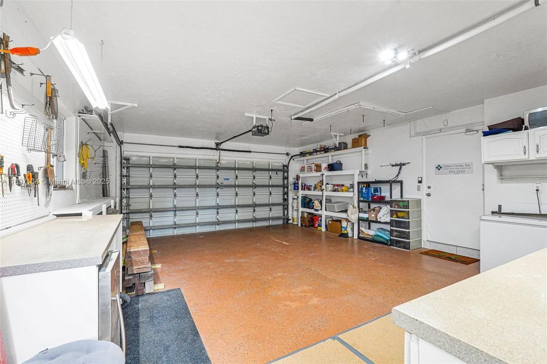 Spacious two-car garage with additional storage and workspace.