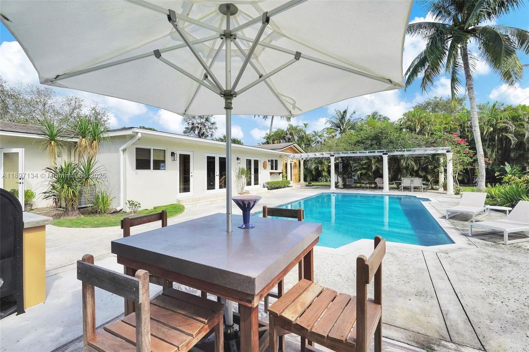 Outdoor firepit and seating area for cozy evenings under the Palmetto Bay sky.