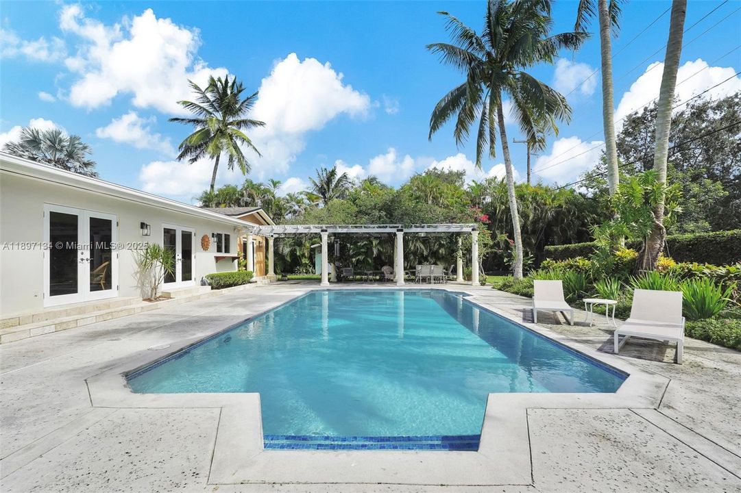 Expansive pool area ideal for relaxation and family gatherings.