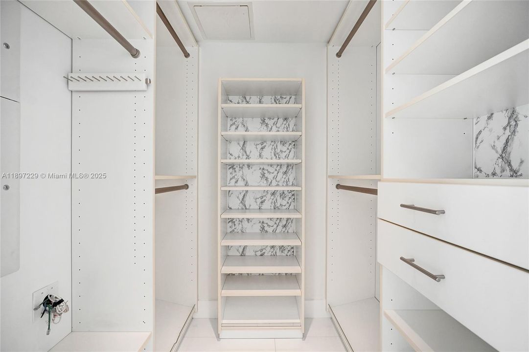 1 OF 2 WALK IN CLOSETS IN THE PRIMARY SUITE