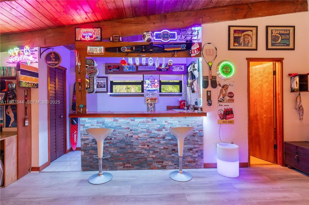 Has a bar and bathroom