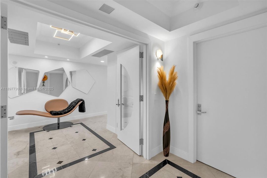 Private elevator foyer with double door entry