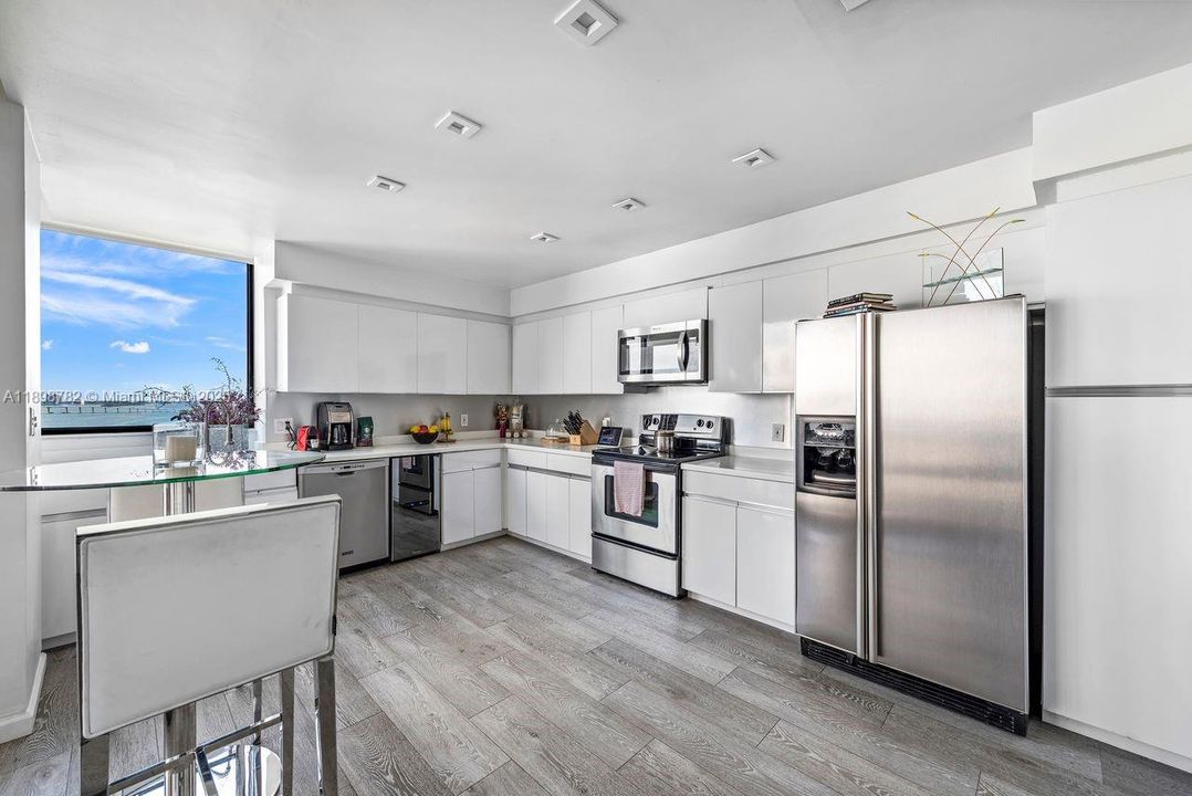 Updated cabinets, flooring & appliances