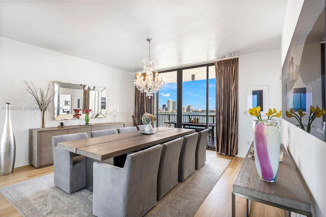 Dining room with floor to ceiling sliding door leading to North Balcony