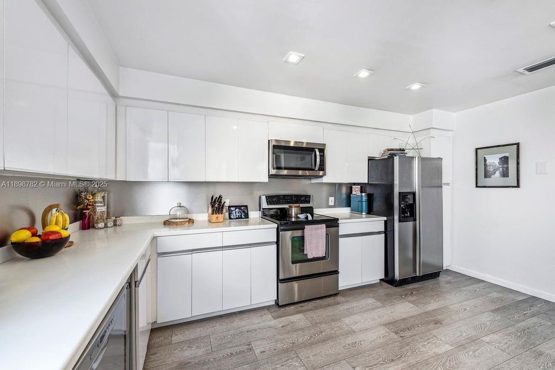 Updated cabinets, flooring & appliances