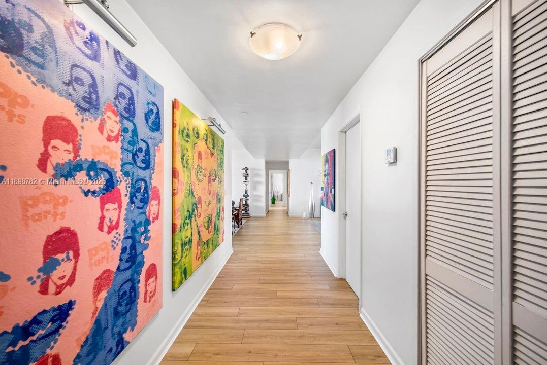 Foyer hallway view & 1st door to right half bathroom