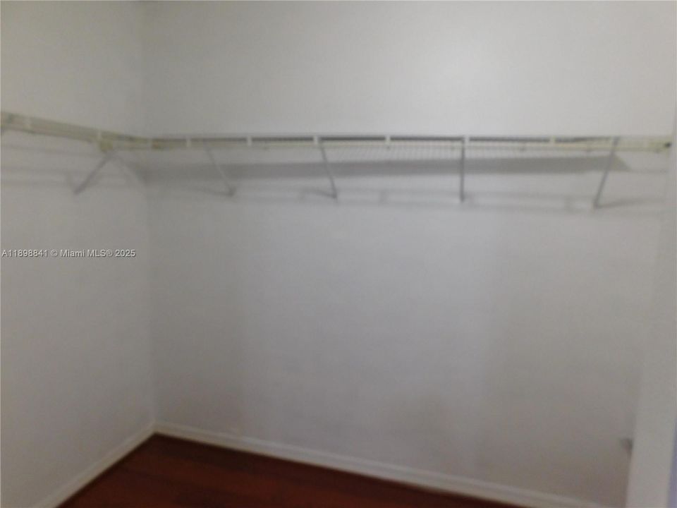 walk-in closet in master bedroom