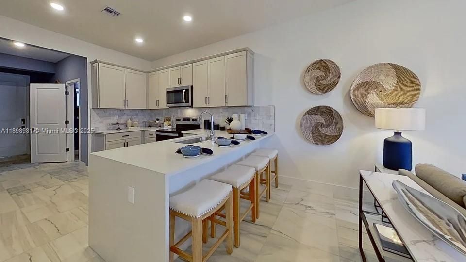 Photos showcase builder’s model home finishes and furnitures