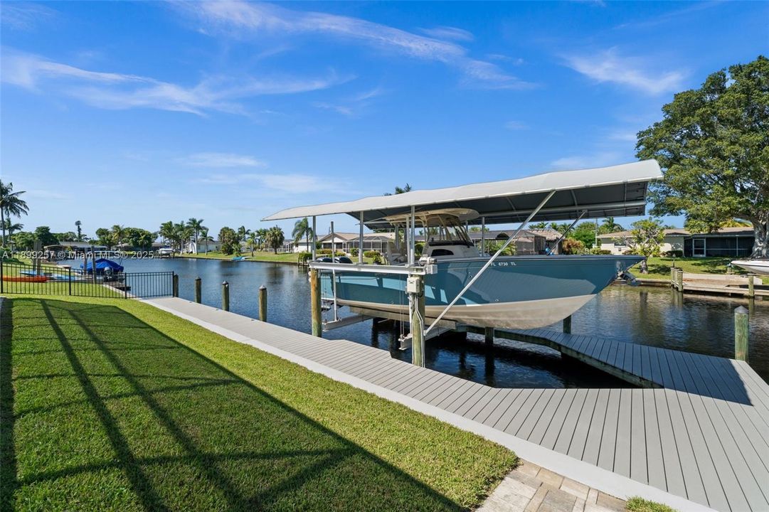Full-length captains walk and dock surrounding the boat lift