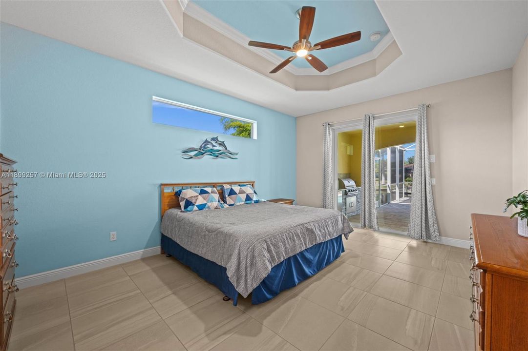 Primary bedroom overlooking the pool