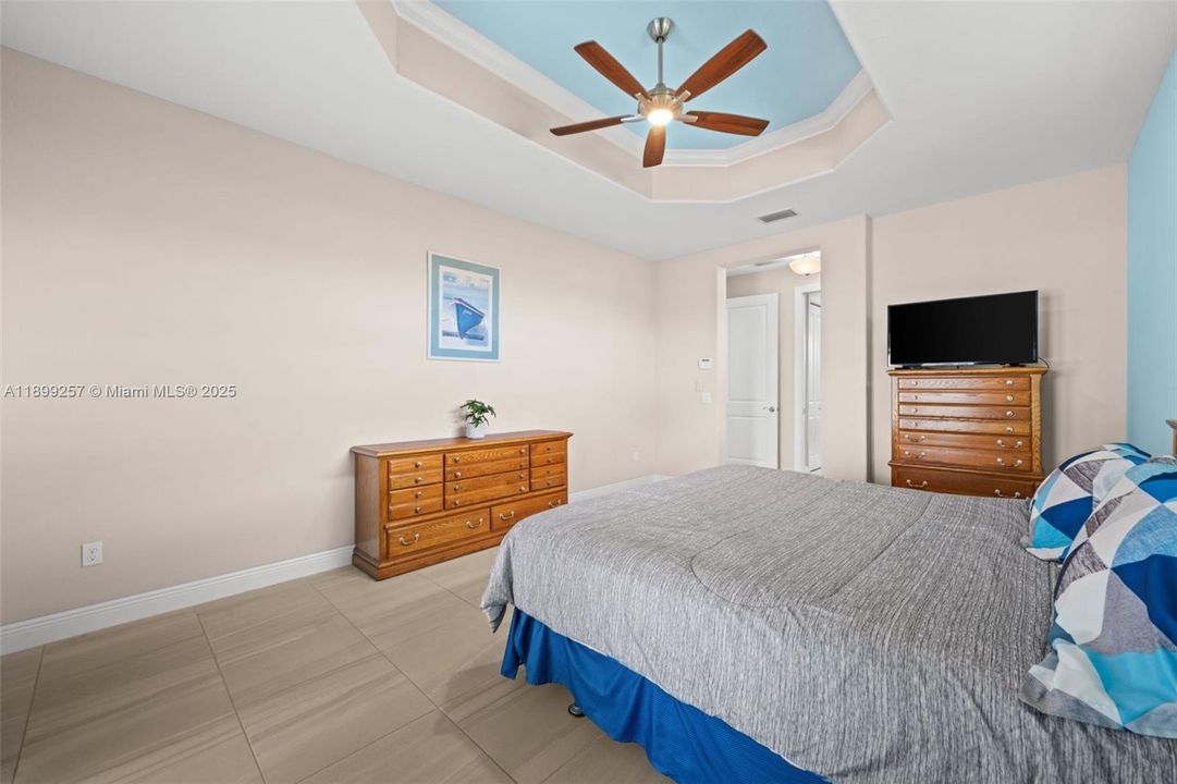 Primary bedroom with tray ceiling