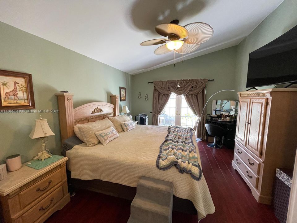 Master Bedroom French doors to pool courtyard.