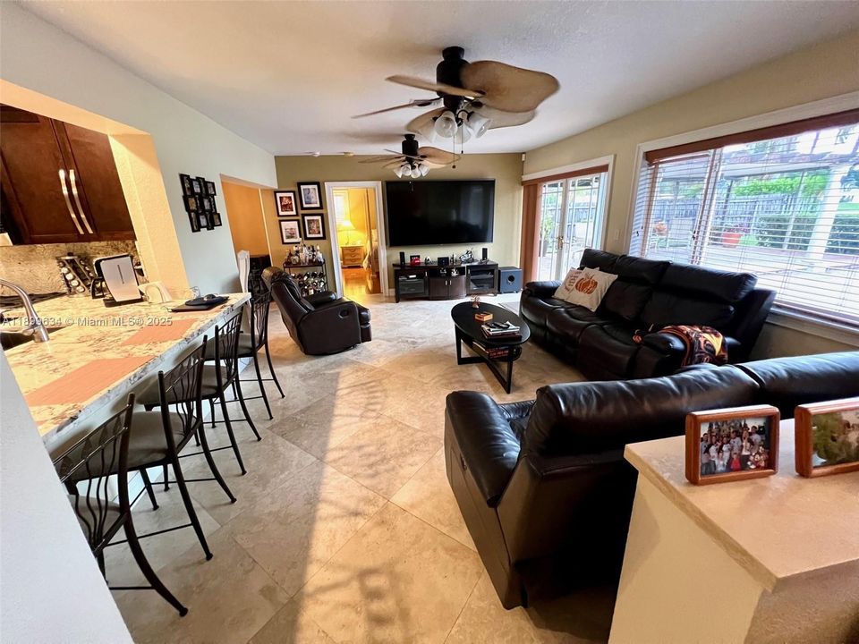 Family room with counter seating at kitchen granite countertop