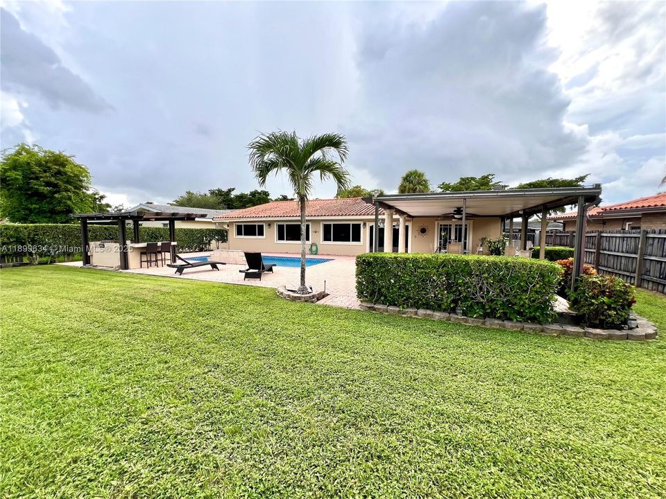 View from back of property showing large fenced backyard