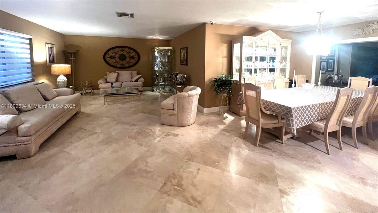View of living room and formal dining room as you enter foyer