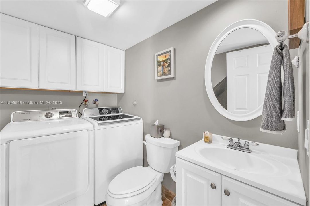 First Level powder room with laundry and storage