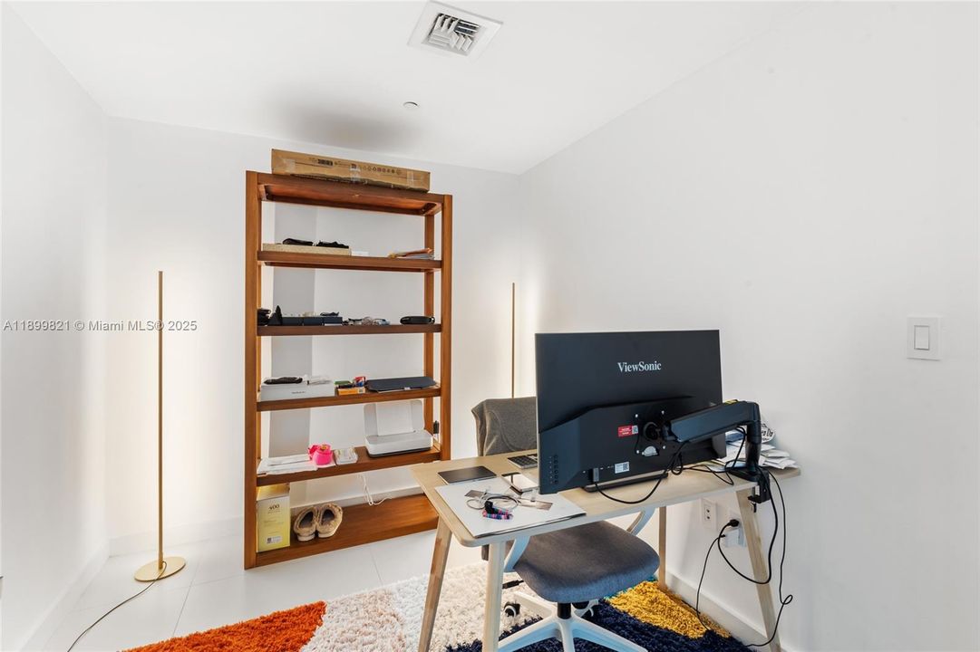 The den can be used as an office or as a second bedroom