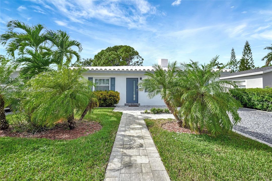 Another perspective of the home’s front showcasing its elegant walkway and welcoming entry.