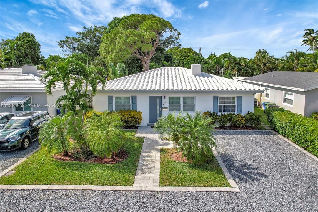 Charming curb appeal with a manicured front yard, sleek façade, and a welcoming entryway that sets the tone for the rest of the home.