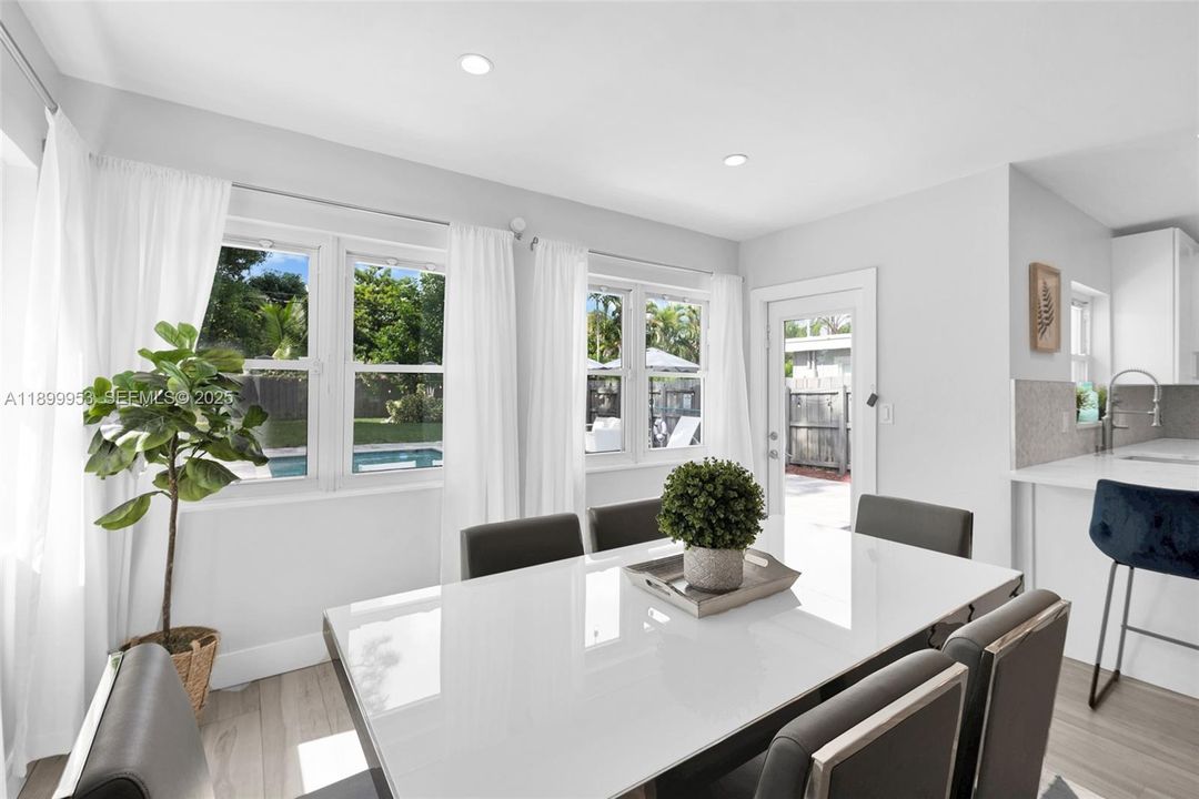 Sunlit dining area with peaceful garden views, creating a warm and inviting atmosphere for daily meals.