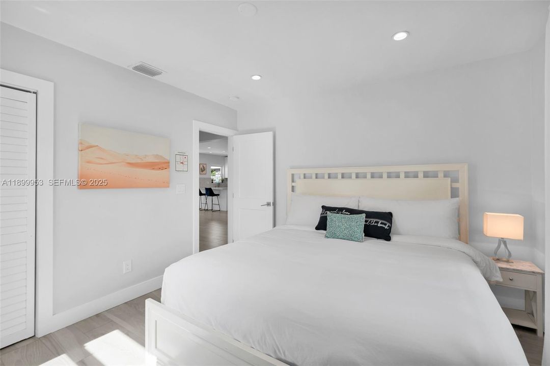 Spacious secondary bedroom featuring neutral tones and plenty of natural light.