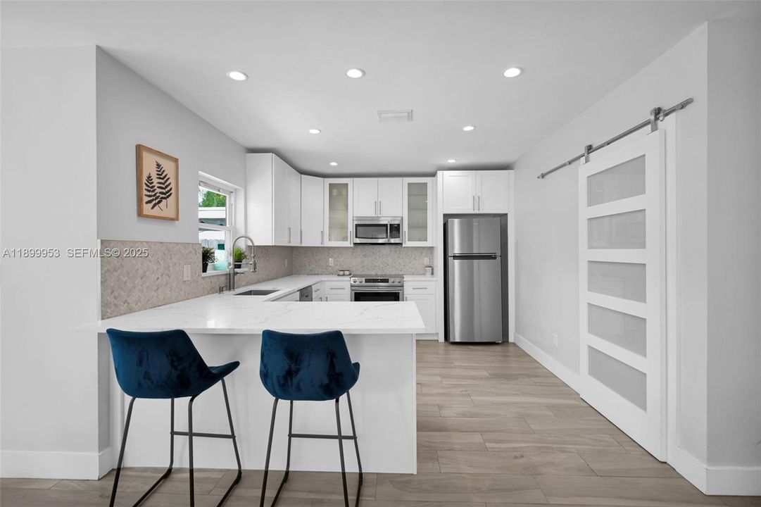 Functional and stylish kitchen with plenty of storage and elegant modern details.