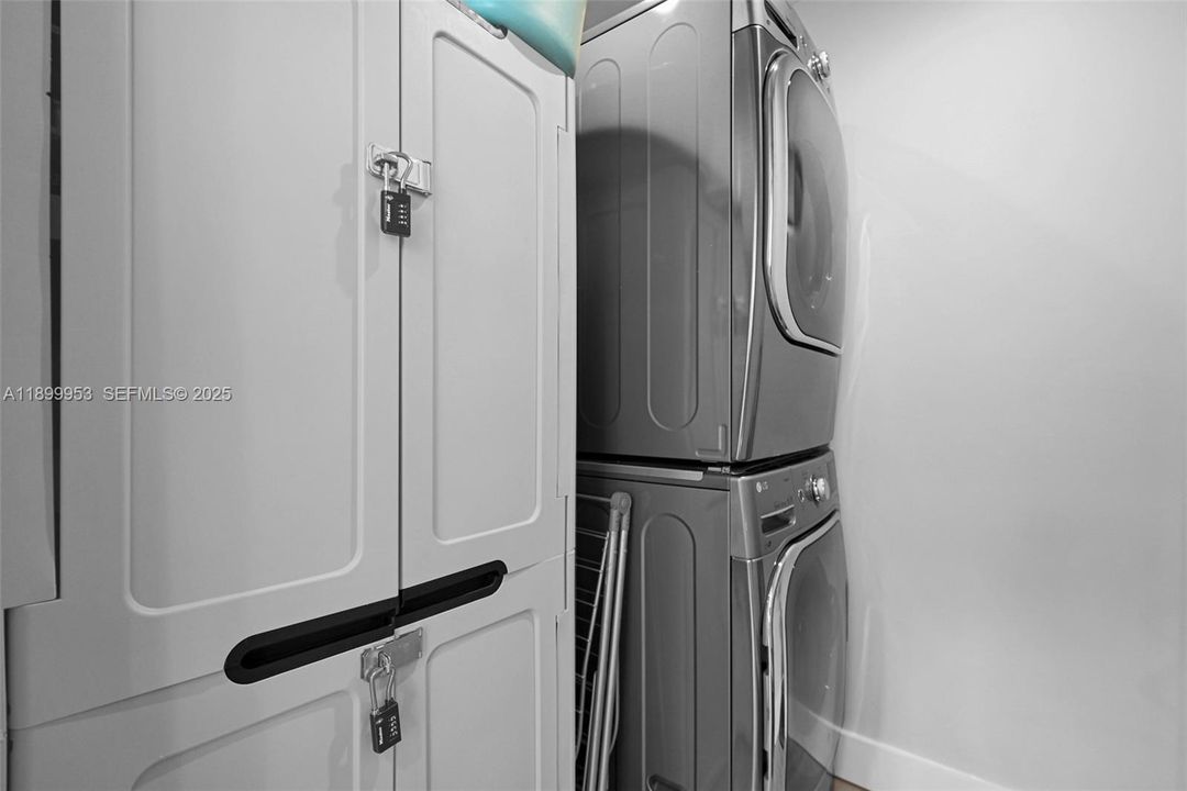 Convenient laundry area with modern appliances and functional storage space.