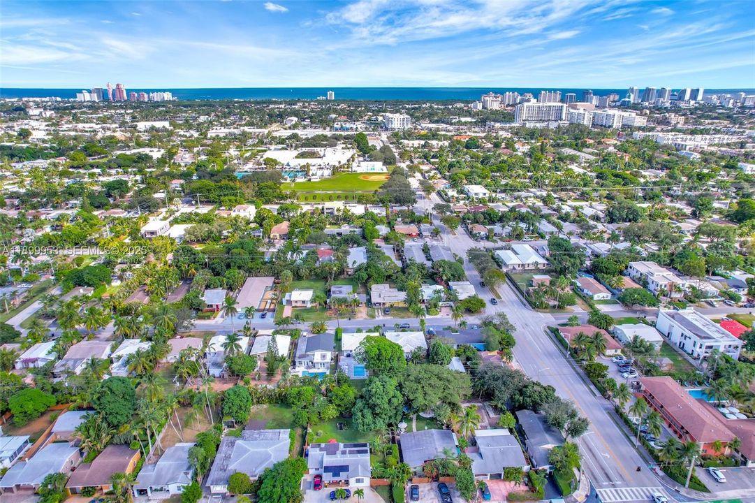 Aerial view highlighting the home’s desirable location within a peaceful neighborhood and its proximity to local amenities.