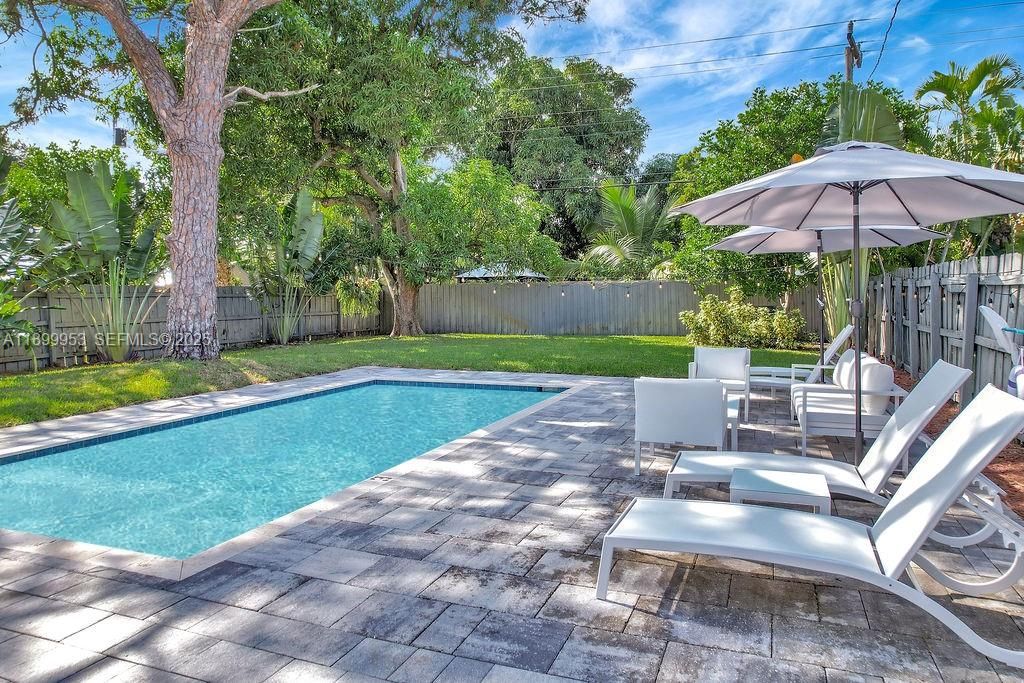 Sparkling pool surrounded by palm trees