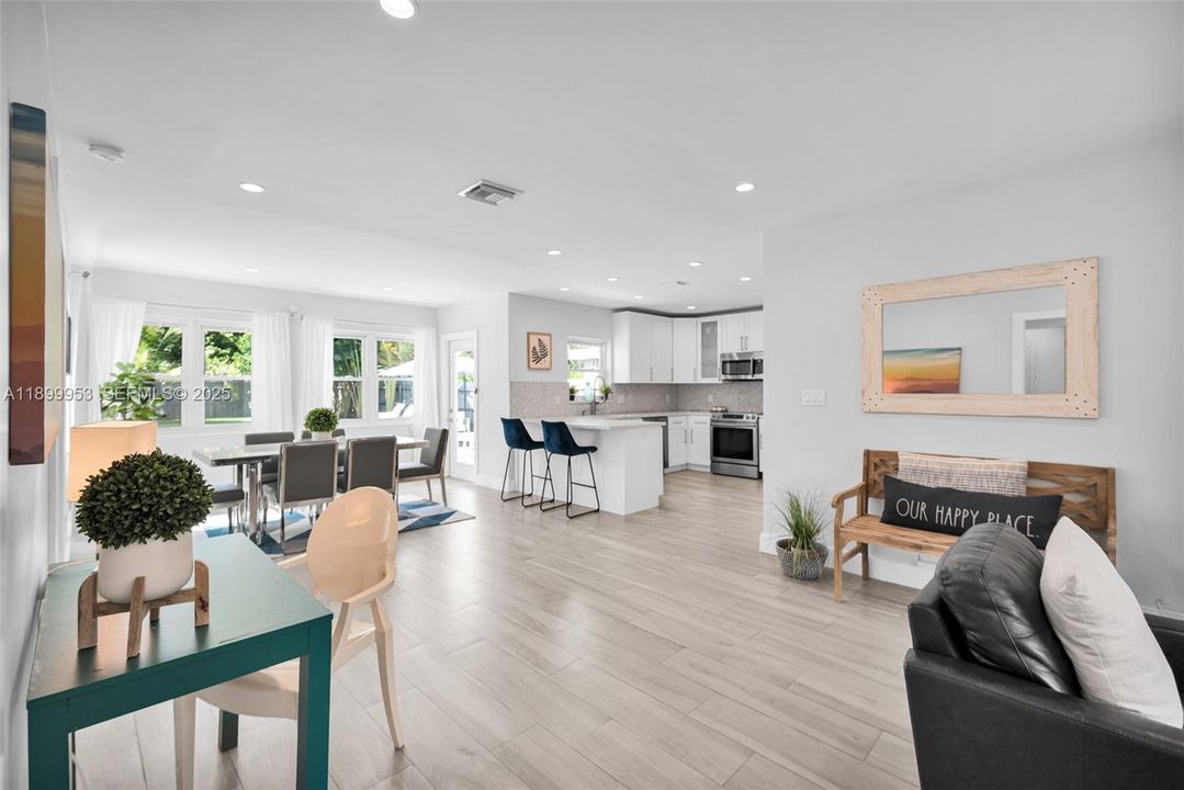 Modern living space with designer touches and abundant natural light from large windows.