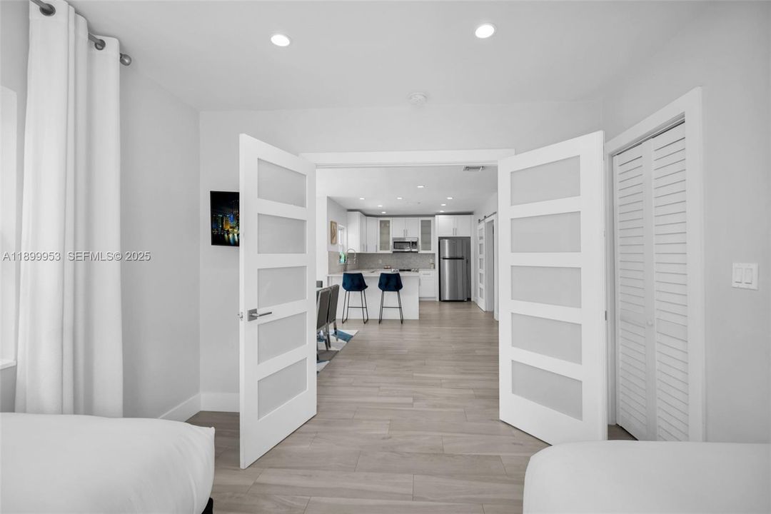 Inviting hallway with modern finishes and direct sightlines to the home’s open layout.