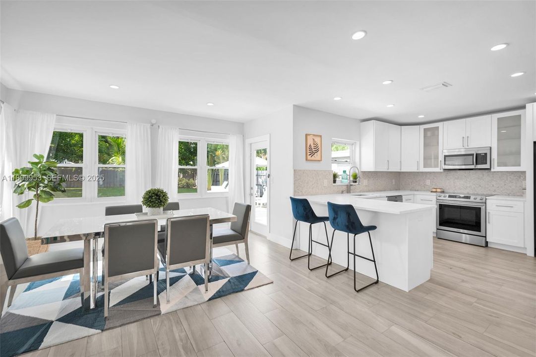 Gorgeous open kitchen with breakfast bar seating and premium finishes that elevate the heart of the home.
