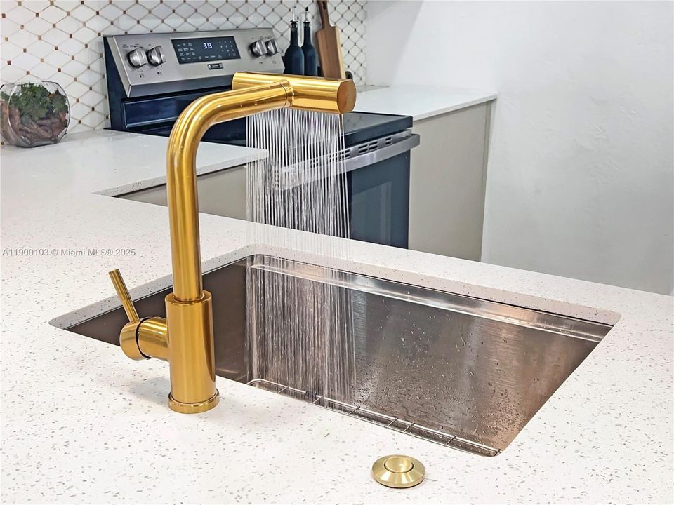 Touchless Waterfall Kitchen Faucet with Pull Down Sprayer.