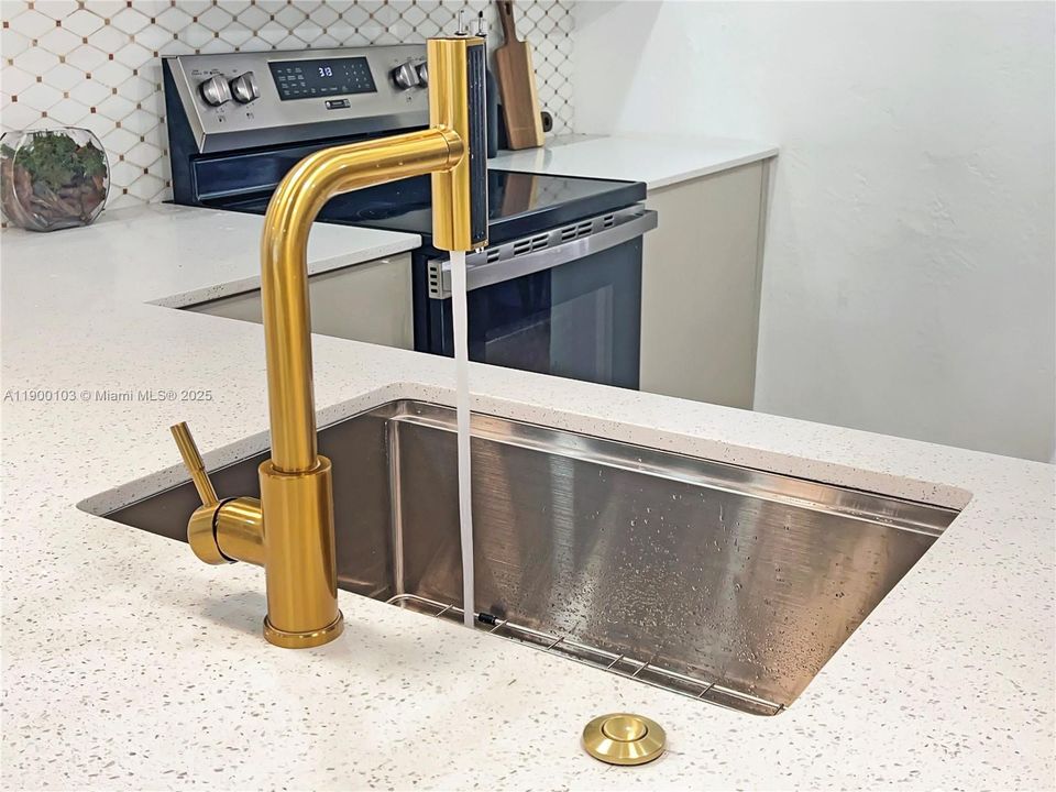 Touchless Waterfall Kitchen Faucet with Pull Down Sprayer.
