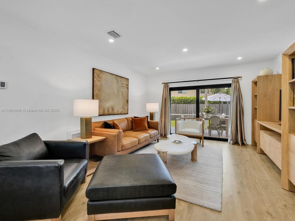 Large, Bright Living with Sliding Doors to the Breezy Screened-in Patio