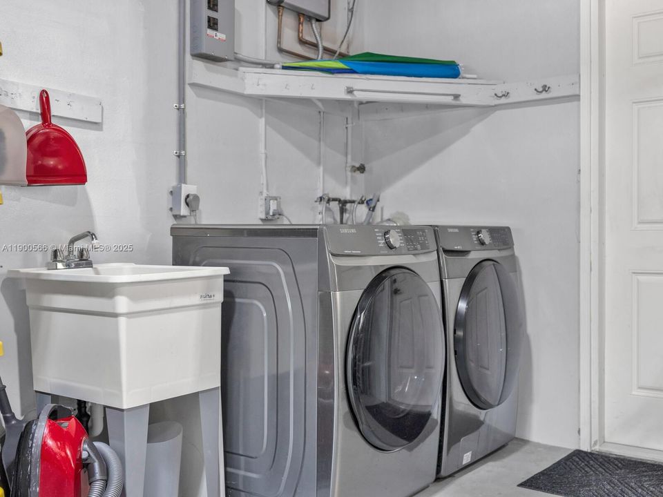 New Laundry Machines in Expansive Two-car Garage