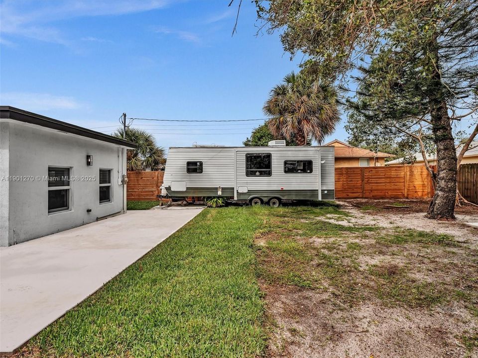 Backyard is ready to create your own oasis. Large Concrete patio surrounding the house.