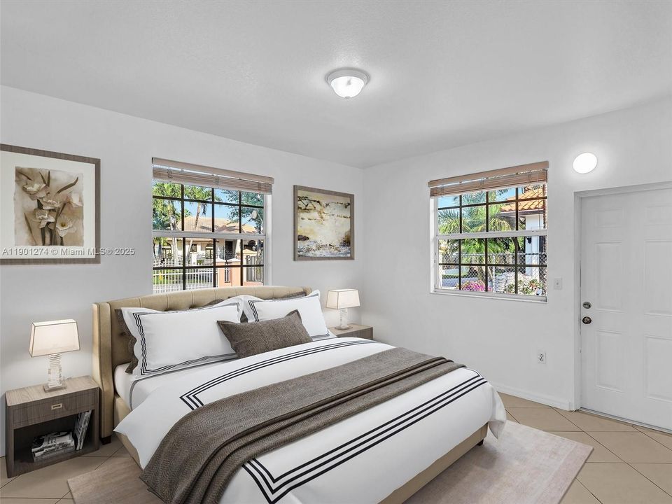 Bedroom # 2  with private entrance and bathroom. Virtually Staged Photo.