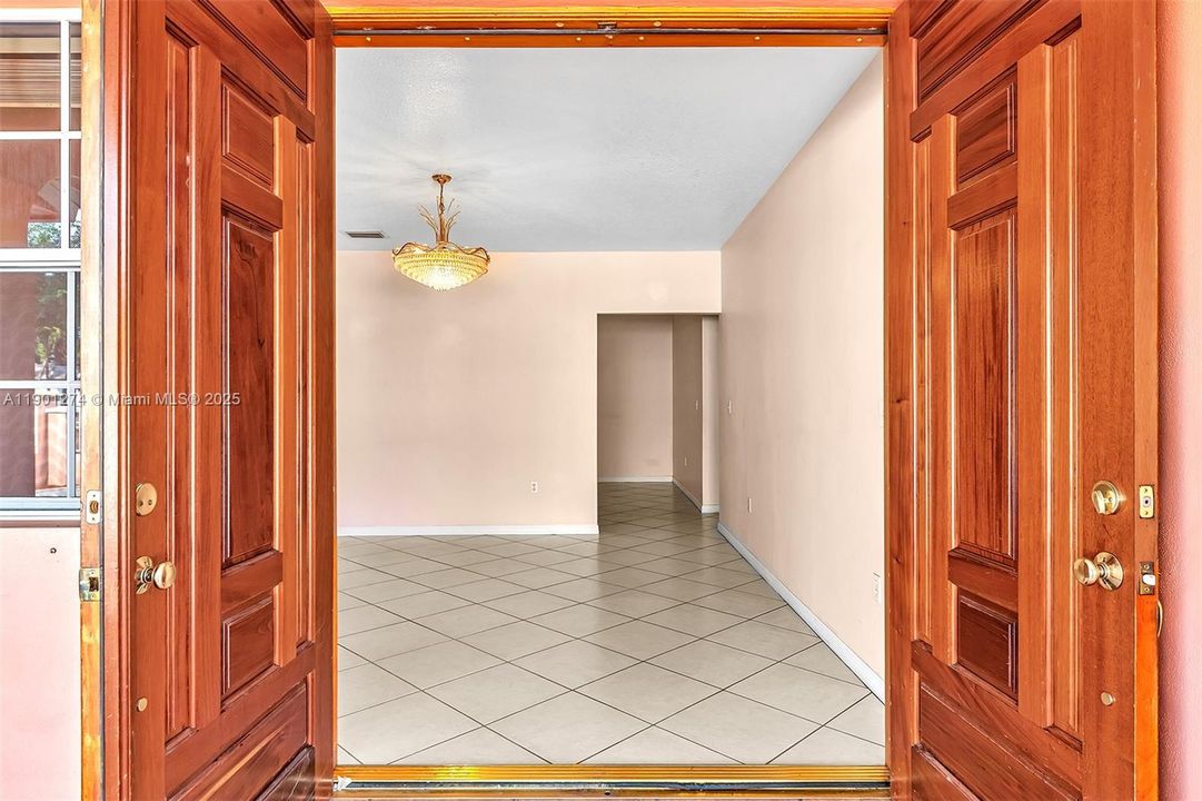 Wide Doble Doors open to the Formal Living room.