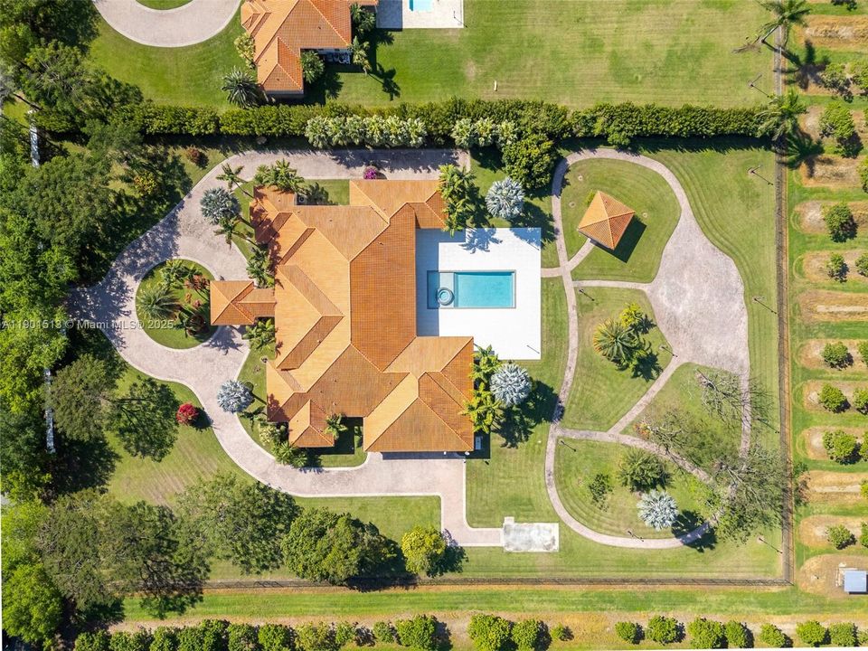 FOOTPRINT VIEW OF THIS AMAZING ESTATE... SHES IMPRESSIVE! A BIG GIRL IN PRISTINE CONDITION. FENCED AND CROSS FENCED, CLOSE TO KENDALL AND KROME AVE, MULTIPLE WINGS W GARAGES ON BOTH SIDES. ALL ARE SUITES WITH 2 OVERSIZED, THE MEDIA ROOM W WET BAR OPENS TO POOL/PATIO W A SOUND SYSTEM INM MEDIA AND A WI FI THRU OUT. SHE IS SET UP FOR SEMINARS, EVENTS, ETC..