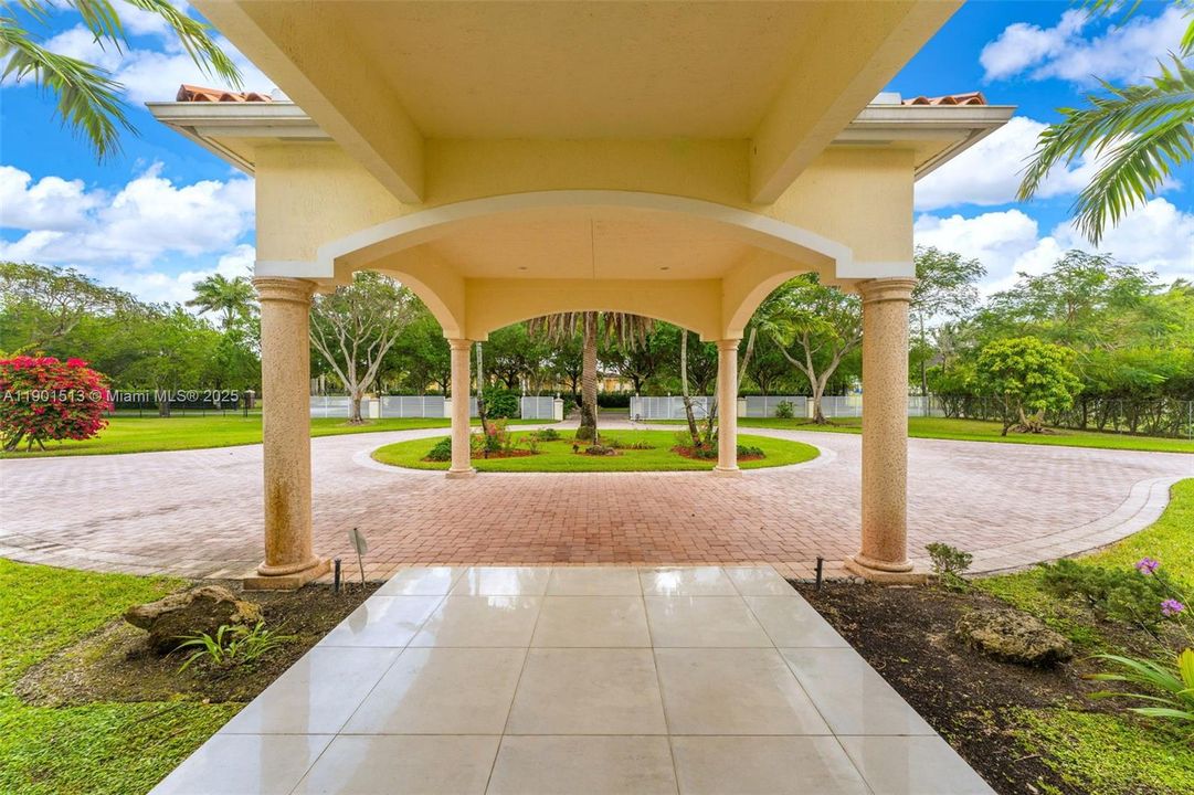 VIEW FROM THE ENTRY TO THE HOUSE OVER LOOKING THE PORTE-COCHERE'