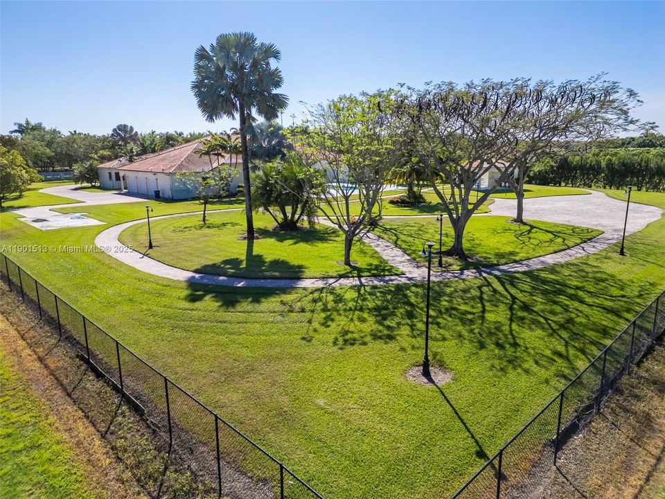 EXTERIOR LIGHTING AND MEANDERING PATHWAYS THROUGHOUT THE PROPERTY.