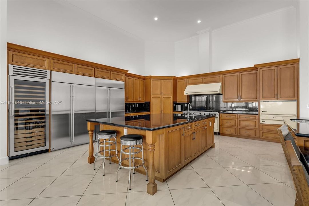 THE SPACE IS EQUIPPED WITH TRIPLE SINKS, DBLS ISLANDS, DOUBLE RANGES, DBL FRIDGES, DBL FREEZERS, WINE FRIDGE, WARMING OVENS, MICRO, DISHWASHER, ETC.MAINLY THE YELLOW TINTED VIKING LINE.THIS KITCHEN CAN HANDLE LARGE EVENTS WITH PLENTY OF PREP AREA AVAIL.. COMES WITH A GREAT VIEW